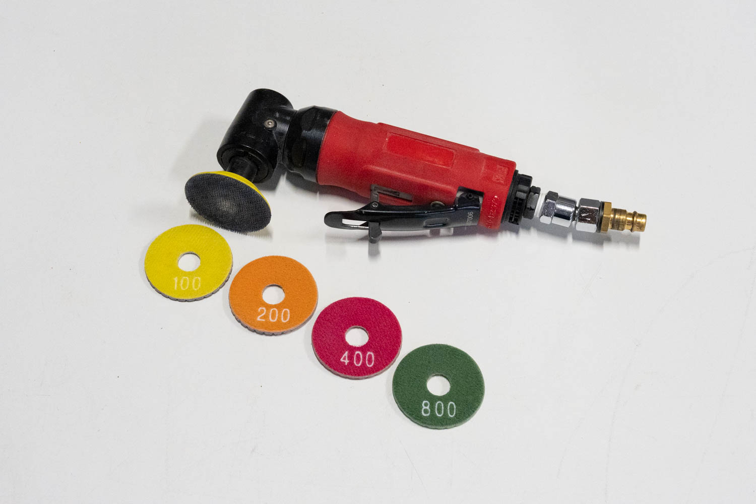 Set: Druckluft Winkelschleifer Mini + Schleifbeläge ø 50 mm (gebraucht)